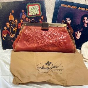 Patricia Nash with dust cover leather satchel